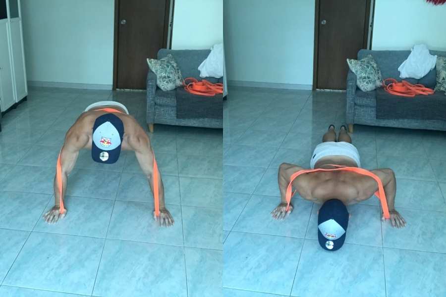 Picture of how a beginner can do the push up using resistance bands.