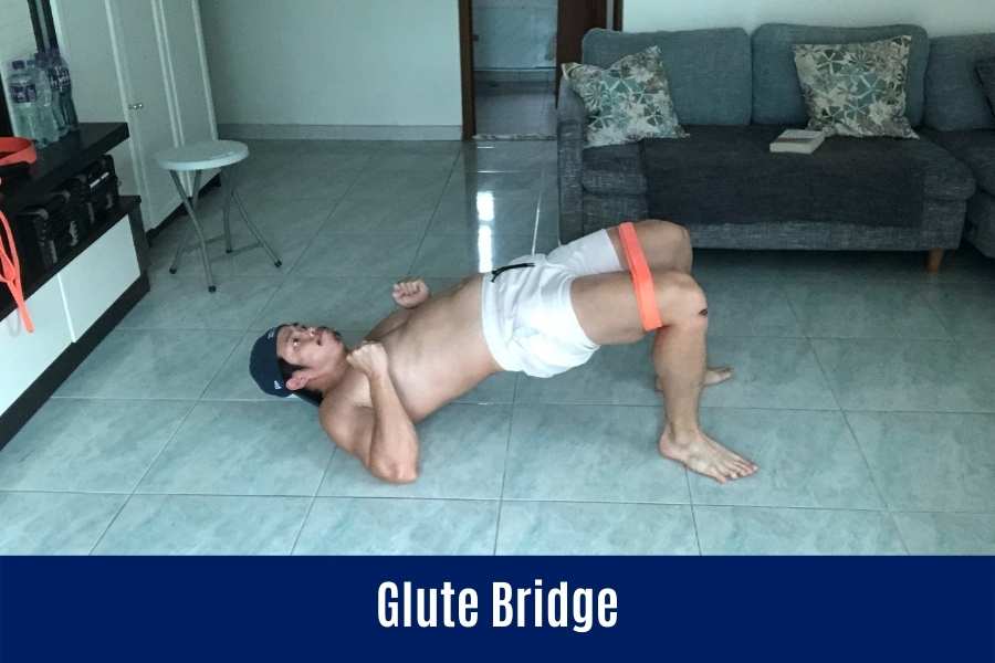 How to do the resistance band bodyweight glute bridge.